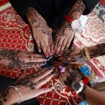 Yemeni girls show their hands decorated with traditional henna designs in the Yemeni capital, Sanaa, on July 29, 2014 as they celebrate Eid al-Fitr, which marks the end of the Muslim fasting month of Ramadan. During Ramadan, observant Muslims do not drink, eat or have sexual relations between dawn and nightfall. AFP PHOTO / MOHAMMED HUWAIS